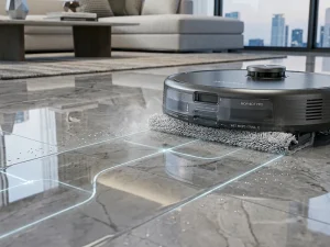 Robot aspirator cu mop performant curățând pete de pe podea dură.